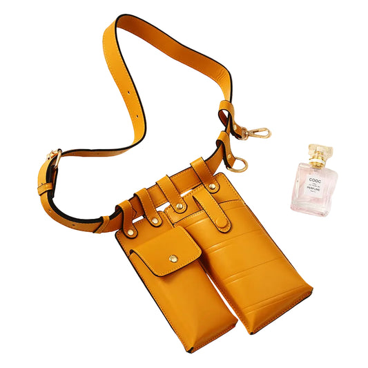 Yellow handbag with a strap on a white surface with a magazine underneath