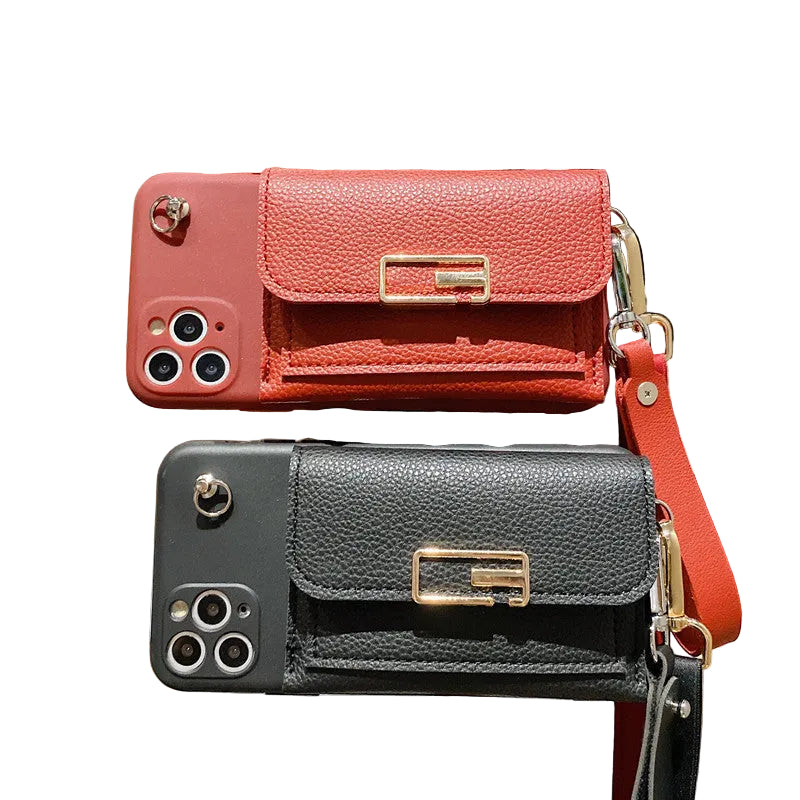 Two phone cases shaped like handbags, one red and one black, held up against a blurred indoor background.